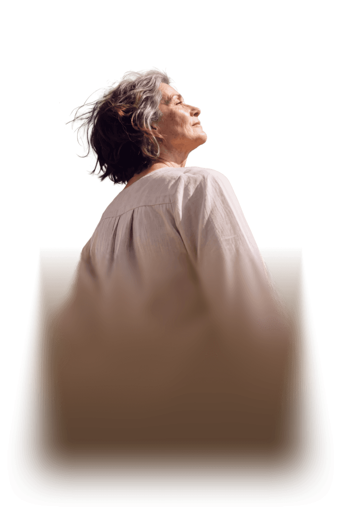 A woman looking up into the sunlight